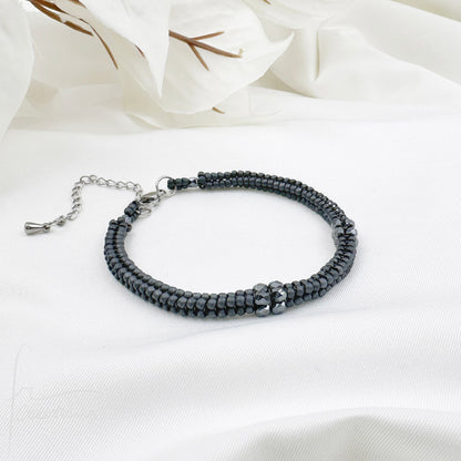Bracciale Kubik artigianale intrecciato a mano con perline e mezzi Cristalli di Swarovski