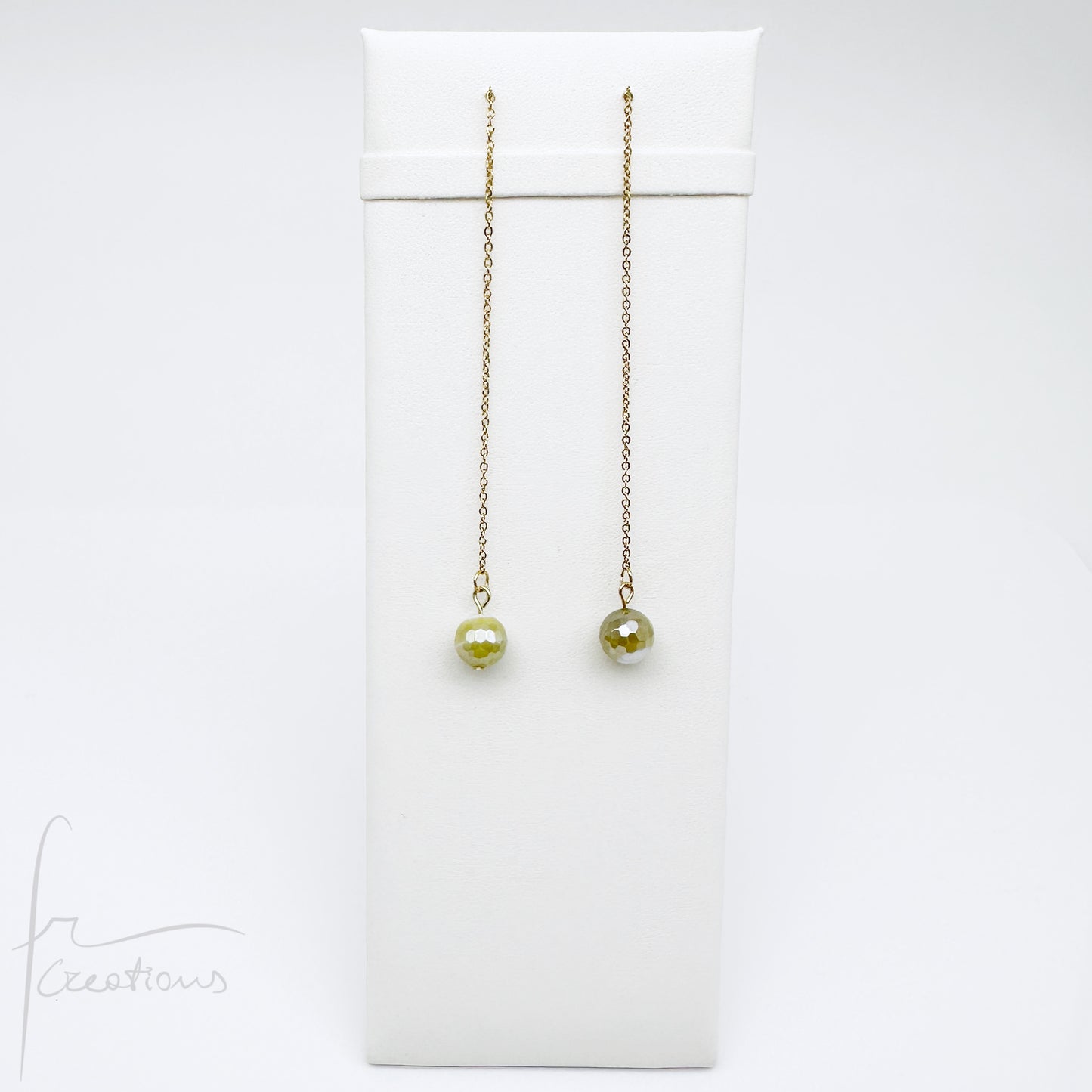 Mono orecchini pendenti  saliscendi con agata striata sfaccettata