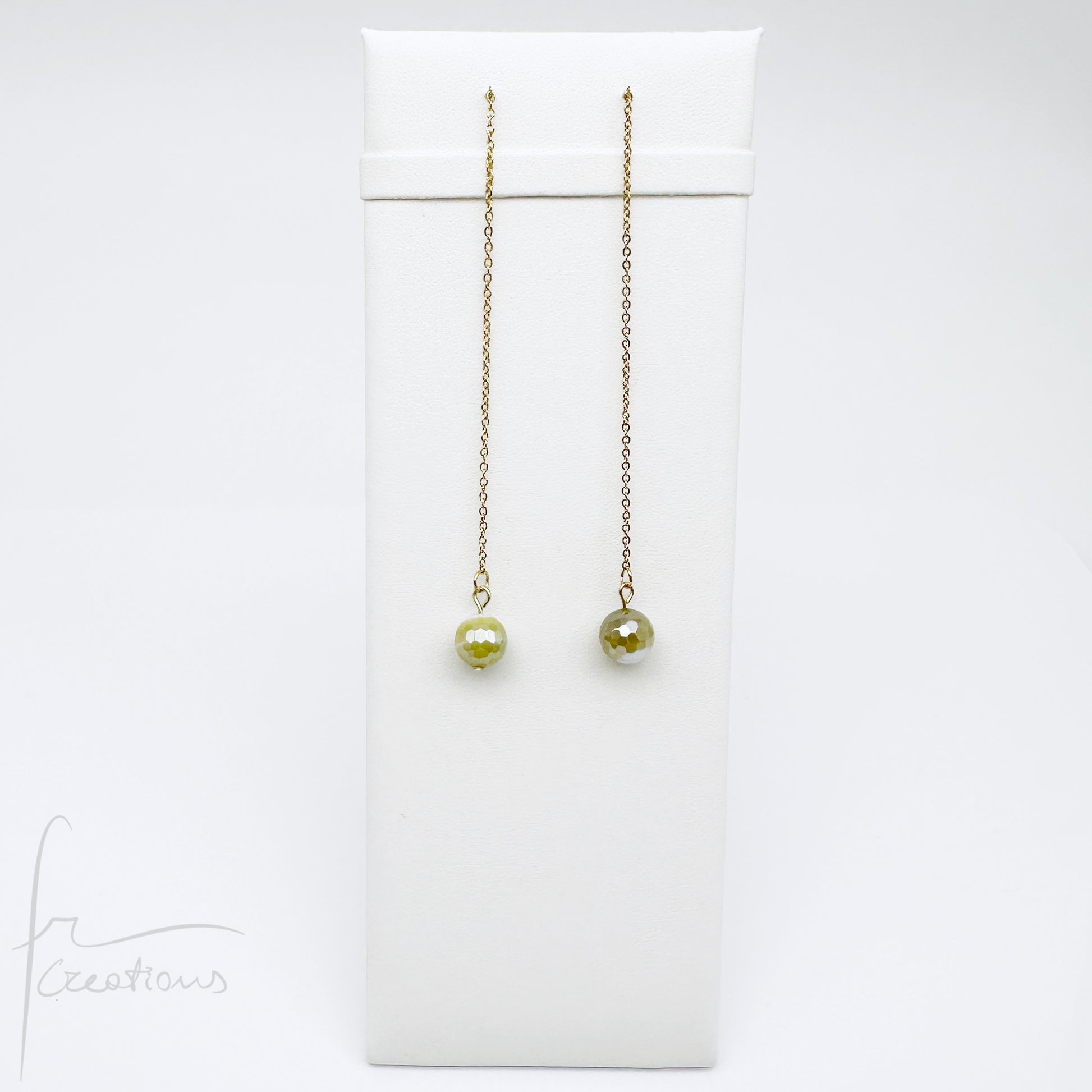 Mono orecchini pendenti  saliscendi con agata striata sfaccettata