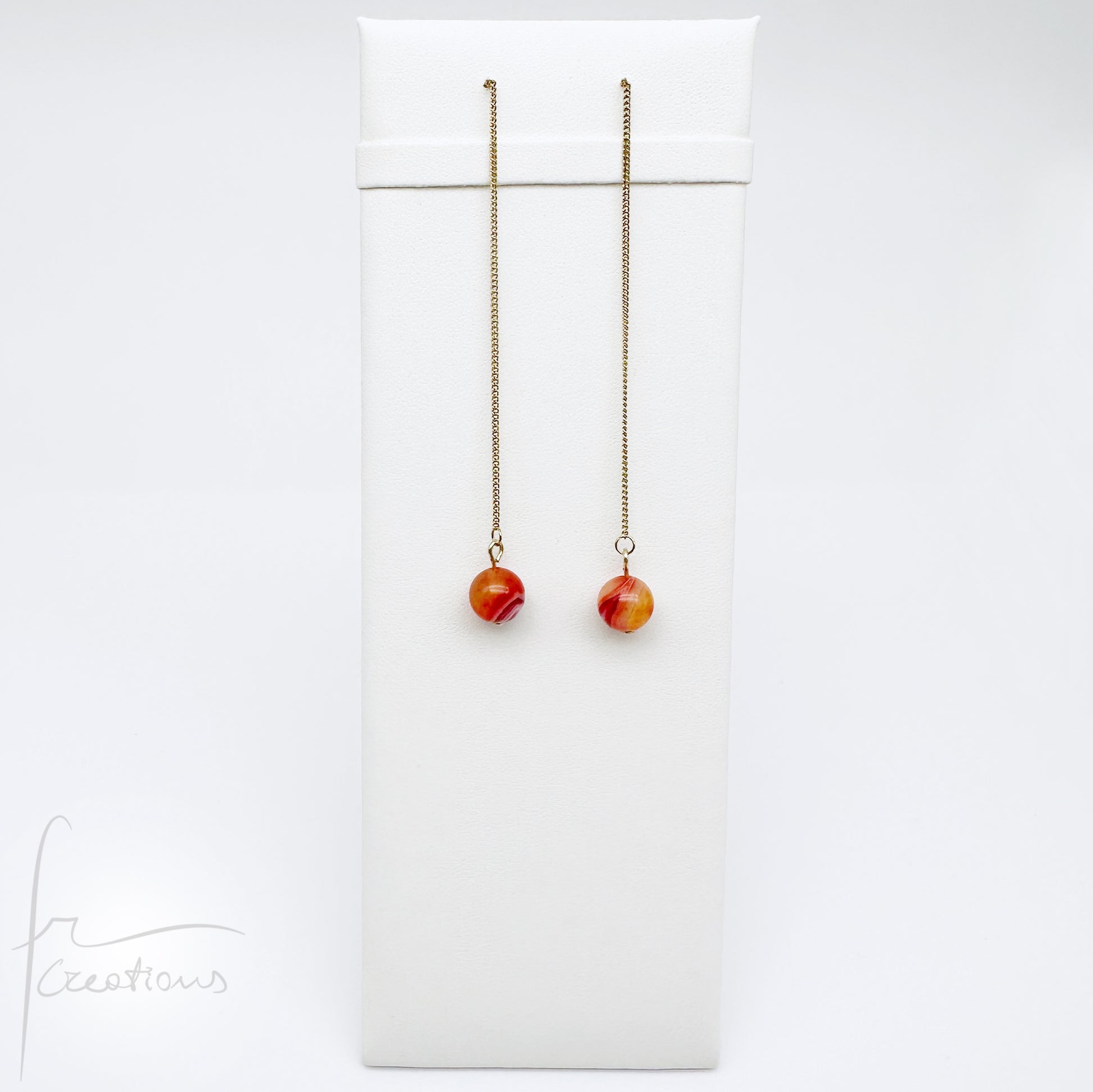 Mono orecchini pendenti  saliscendi con agata striata ruby