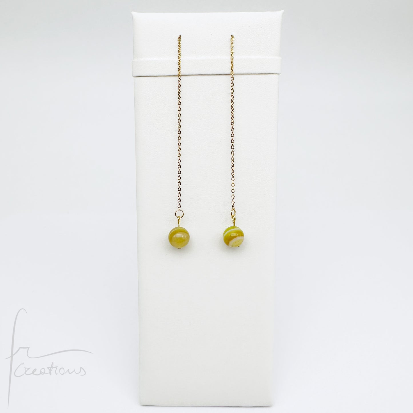 Mono orecchini pendenti  saliscendi con agata striata giallo pomelo