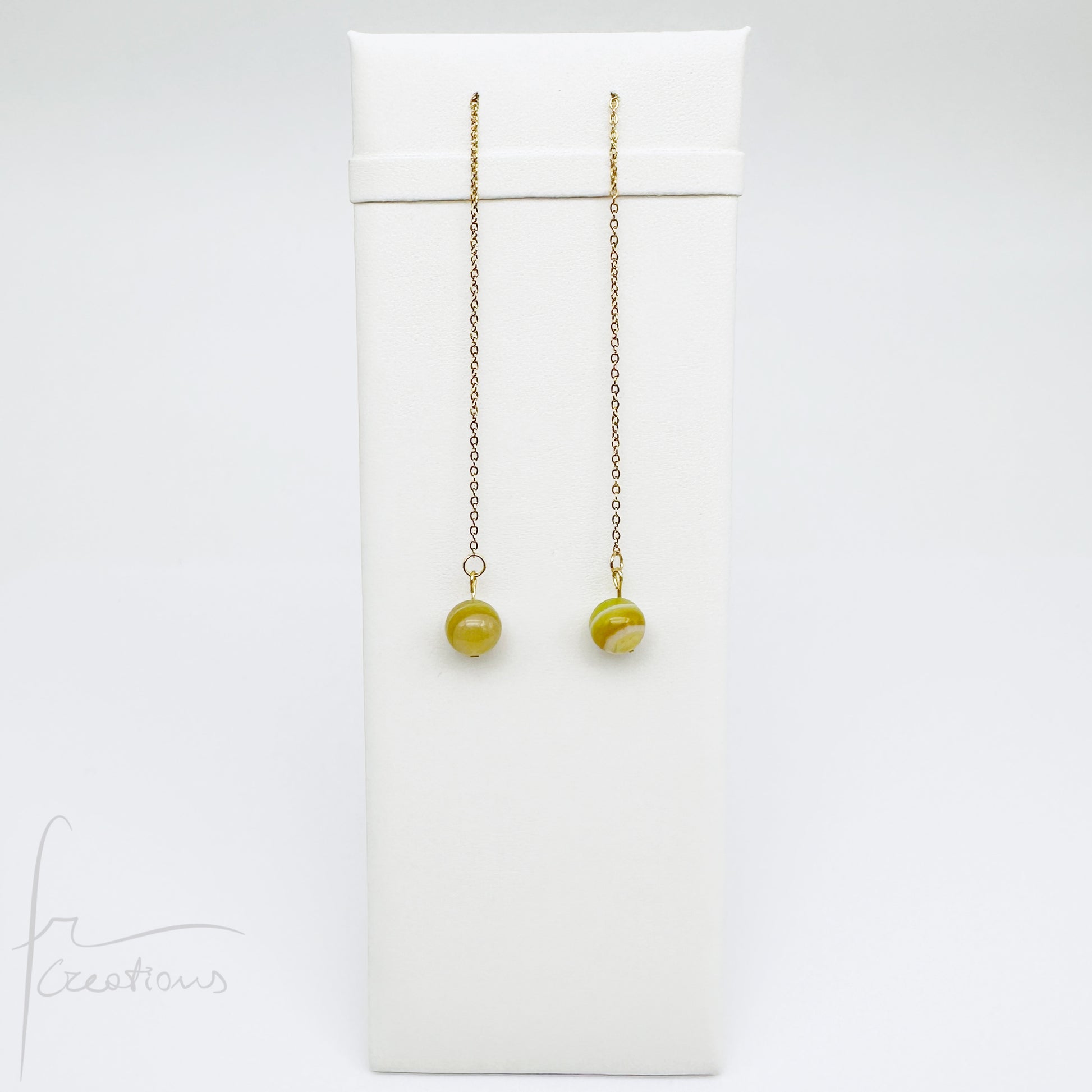 Mono orecchini pendenti  saliscendi con agata striata giallo pomelo